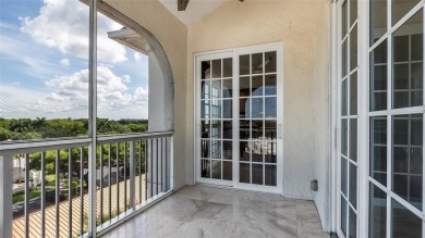 Experience true penthouse living in this exceptional top-floor on Palm-Aire Country Club and Resort - The Oaks in Florida - for sale on GolfHomes.com, golf home, golf lot