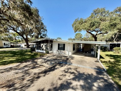 Home is located in Water Oak Country Club Estates in Lady Lake on Water Oak Country Club Estates in Florida - for sale on GolfHomes.com, golf home, golf lot