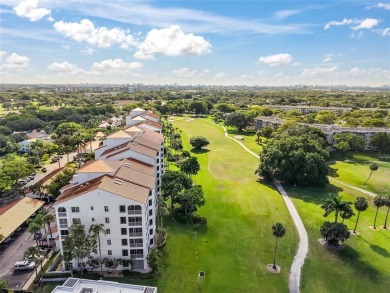 Experience true penthouse living in this exceptional top-floor on Palm-Aire Country Club and Resort - The Oaks in Florida - for sale on GolfHomes.com, golf home, golf lot