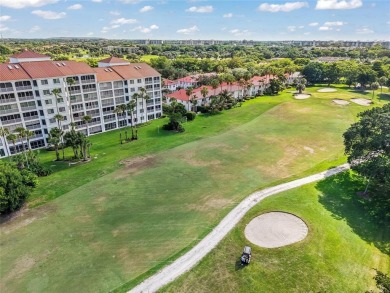 Experience true penthouse living in this exceptional top-floor on Palm-Aire Country Club and Resort - The Oaks in Florida - for sale on GolfHomes.com, golf home, golf lot