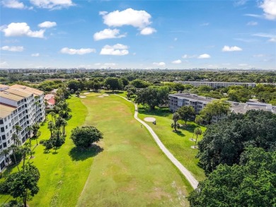 Experience true penthouse living in this exceptional top-floor on Palm-Aire Country Club and Resort - The Oaks in Florida - for sale on GolfHomes.com, golf home, golf lot