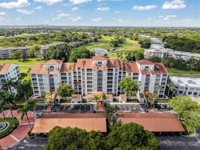 Experience true penthouse living in this exceptional top-floor on Palm-Aire Country Club and Resort - The Oaks in Florida - for sale on GolfHomes.com, golf home, golf lot