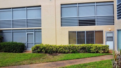 WELCOME TO THIS SPARKLING FULLY TILED CORNER CONDO AVAILABLE on Poinciana Golf Club in Florida - for sale on GolfHomes.com, golf home, golf lot