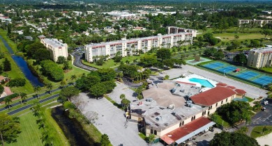 WELCOME TO THIS SPARKLING FULLY TILED CORNER CONDO AVAILABLE on Poinciana Golf Club in Florida - for sale on GolfHomes.com, golf home, golf lot