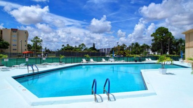 WELCOME TO THIS SPARKLING FULLY TILED CORNER CONDO AVAILABLE on Poinciana Golf Club in Florida - for sale on GolfHomes.com, golf home, golf lot