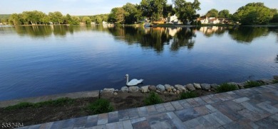 Completely renovated in 2020 this year round home sits on the on Lake Lackawanna Golf Course in New Jersey - for sale on GolfHomes.com, golf home, golf lot