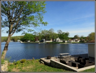 Completely renovated in 2020 this year round home sits on the on Lake Lackawanna Golf Course in New Jersey - for sale on GolfHomes.com, golf home, golf lot