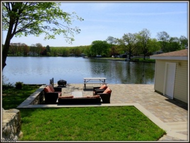 Completely renovated in 2020 this year round home sits on the on Lake Lackawanna Golf Course in New Jersey - for sale on GolfHomes.com, golf home, golf lot