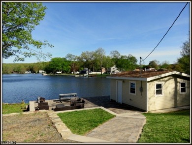 Completely renovated in 2020 this year round home sits on the on Lake Lackawanna Golf Course in New Jersey - for sale on GolfHomes.com, golf home, golf lot