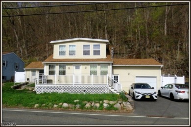 Completely renovated in 2020 this year round home sits on the on Lake Lackawanna Golf Course in New Jersey - for sale on GolfHomes.com, golf home, golf lot