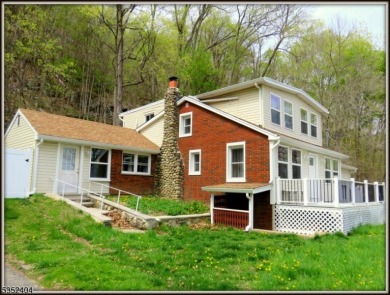 Completely renovated in 2020 this year round home sits on the on Lake Lackawanna Golf Course in New Jersey - for sale on GolfHomes.com, golf home, golf lot