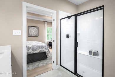 Welcome to Resort Style Living a golf cart ride to Sunset Beach on Sea Trail Golf Resort in North Carolina - for sale on GolfHomes.com, golf home, golf lot