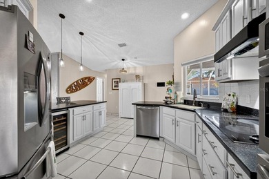 Under contract-accepting backup offers. BRAND NEW ROOF! on The Grand Club - Pine Lakes Course in Florida - for sale on GolfHomes.com, golf home, golf lot