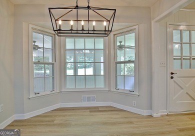 From the moment you walk into this home you know it has been on Canongate At Flat Creek Club in Georgia - for sale on GolfHomes.com, golf home, golf lot