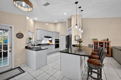 Under contract-accepting backup offers. BRAND NEW ROOF! on The Grand Club - Pine Lakes Course in Florida - for sale on GolfHomes.com, golf home, golf lot