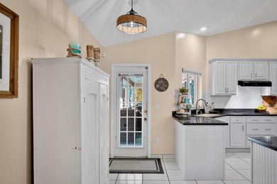 Under contract-accepting backup offers. BRAND NEW ROOF! on The Grand Club - Pine Lakes Course in Florida - for sale on GolfHomes.com, golf home, golf lot