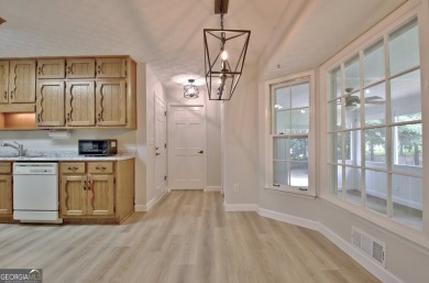 From the moment you walk into this home you know it has been on Canongate At Flat Creek Club in Georgia - for sale on GolfHomes.com, golf home, golf lot