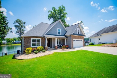 Stunning Lakefront Retreat with 225+ Feet of Shoreline  Welcome on Fairfield Plantation Golf and Country Club in Georgia - for sale on GolfHomes.com, golf home, golf lot