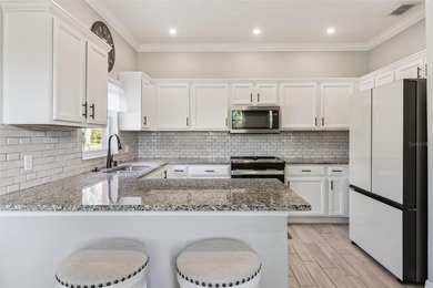 Enjoy easy access to a year-round heated swimming pool without on Stonegate Golf Club in Florida - for sale on GolfHomes.com, golf home, golf lot