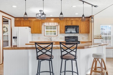 Just a short walk to the Atlantic ocean, this spacious raised on Tupelo Bay Golf Complex  in South Carolina - for sale on GolfHomes.com, golf home, golf lot