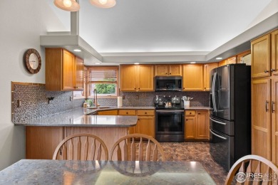 Cute as can be and packed with perks! This 3 bed, 3 bath ranch on Mad Russian Golf Course in Colorado - for sale on GolfHomes.com, golf home, golf lot