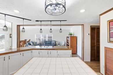 Just a short walk to the Atlantic ocean, this spacious raised on Tupelo Bay Golf Complex  in South Carolina - for sale on GolfHomes.com, golf home, golf lot