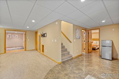 Cute as can be and packed with perks! This 3 bed, 3 bath ranch on Mad Russian Golf Course in Colorado - for sale on GolfHomes.com, golf home, golf lot