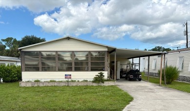 Welcome to 616 Max Rd., a cheerful 1990 Palm Harbor home located on Pelican Pointe Golf and Country Club in Florida - for sale on GolfHomes.com, golf home, golf lot