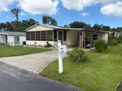 Welcome to 616 Max Rd., a cheerful 1990 Palm Harbor home located on Pelican Pointe Golf and Country Club in Florida - for sale on GolfHomes.com, golf home, golf lot