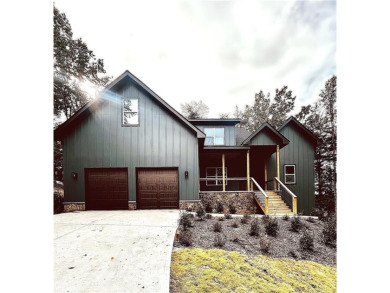 This stunning new construction blends luxury, functionality, and on The Highlands Course at Lake Arrowhead in Georgia - for sale on GolfHomes.com, golf home, golf lot