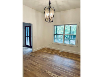 This stunning new construction blends luxury, functionality, and on The Highlands Course at Lake Arrowhead in Georgia - for sale on GolfHomes.com, golf home, golf lot