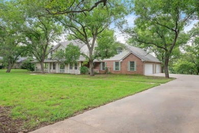 Welcome to this spacious home in the gated community of Pecan on Pecan Plantation Country Club in Texas - for sale on GolfHomes.com, golf home, golf lot