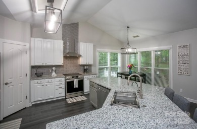 Magnificently updated ranch home built to entertain -- in the on Highland Creek Golf Club in North Carolina - for sale on GolfHomes.com, golf home, golf lot