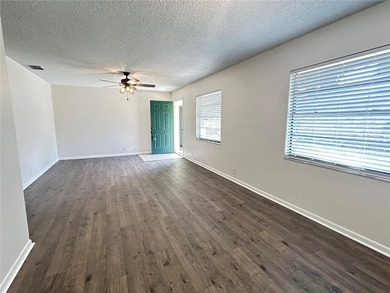 Enjoy the Florida country club lifestyle in this affordable and on Cypresswood Golf and Country Club in Florida - for sale on GolfHomes.com, golf home, golf lot