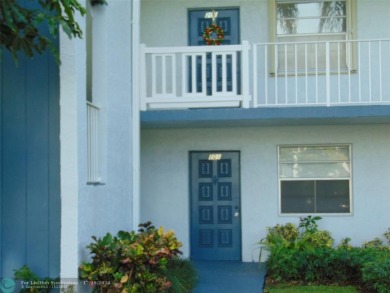 FIRST FLOOR CORNER UNIT WITH GOLF AND WATER VIEW. BEAUTIFUL on Oriole Golf and Tennis Club in Florida - for sale on GolfHomes.com, golf home, golf lot