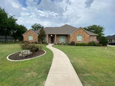 Gorgeous 3 bedroom 3.5 bath plus office home sitting on almost a on Cedar Creek Country Club in Texas - for sale on GolfHomes.com, golf home, golf lot