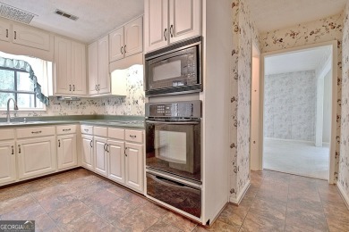 This is your opportunity to live in the heart of Peachtree City on Braelinn Golf Club in Georgia - for sale on GolfHomes.com, golf home, golf lot