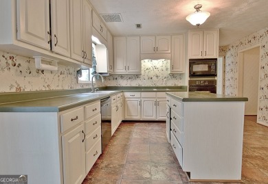 This is your opportunity to live in the heart of Peachtree City on Braelinn Golf Club in Georgia - for sale on GolfHomes.com, golf home, golf lot