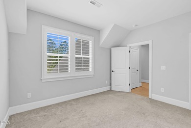 Welcome to this exquisite ICG-built home, completed in 2023 and on Chapel Ridge Golf Club in North Carolina - for sale on GolfHomes.com, golf home, golf lot