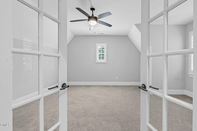 Welcome to this exquisite ICG-built home, completed in 2023 and on Chapel Ridge Golf Club in North Carolina - for sale on GolfHomes.com, golf home, golf lot