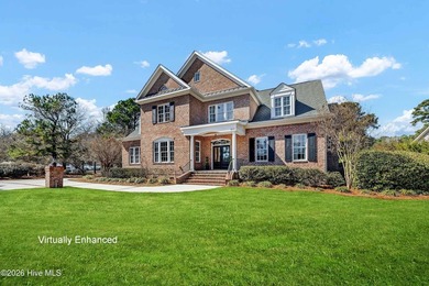 Perfectly situated on the Nicklaus #9 green with tranquil pond on Country Club of Landfall in North Carolina - for sale on GolfHomes.com, golf home, golf lot
