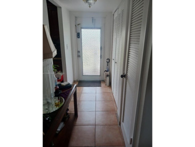 Beautiful 2 bedroom, 2 bath luxury condo with a scenic lake view on Sunrise Lakes Phase III in Florida - for sale on GolfHomes.com, golf home, golf lot
