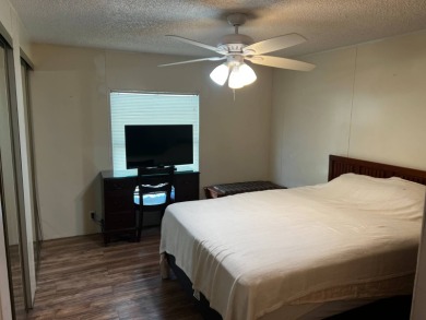 Community living in a great location with tons of activities in on Lake Henry Golf Club in Florida - for sale on GolfHomes.com, golf home, golf lot