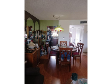 Beautiful 2 bedroom, 2 bath luxury condo with a scenic lake view on Sunrise Lakes Phase III in Florida - for sale on GolfHomes.com, golf home, golf lot