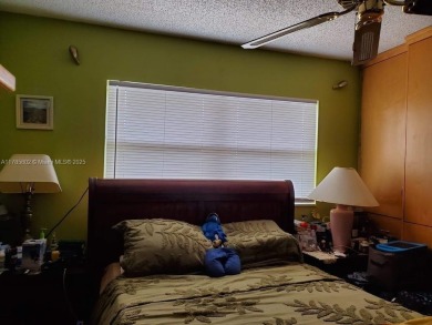 Beautiful 2 bedroom, 2 bath luxury condo with a scenic lake view on Sunrise Lakes Phase III in Florida - for sale on GolfHomes.com, golf home, golf lot