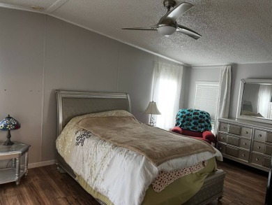 Community living in a great location with tons of activities in on Lake Henry Golf Club in Florida - for sale on GolfHomes.com, golf home, golf lot