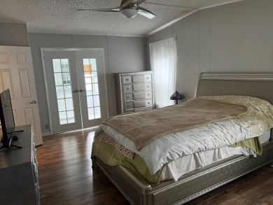 Community living in a great location with tons of activities in on Lake Henry Golf Club in Florida - for sale on GolfHomes.com, golf home, golf lot
