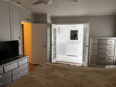 Community living in a great location with tons of activities in on Lake Henry Golf Club in Florida - for sale on GolfHomes.com, golf home, golf lot