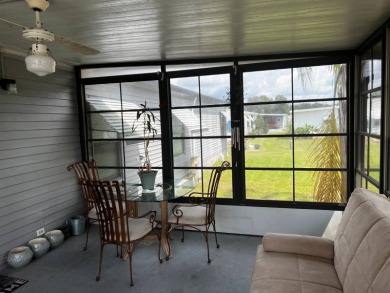 Community living in a great location with tons of activities in on Lake Henry Golf Club in Florida - for sale on GolfHomes.com, golf home, golf lot