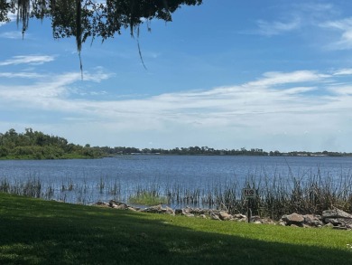 Community living in a great location with tons of activities in on Lake Henry Golf Club in Florida - for sale on GolfHomes.com, golf home, golf lot
